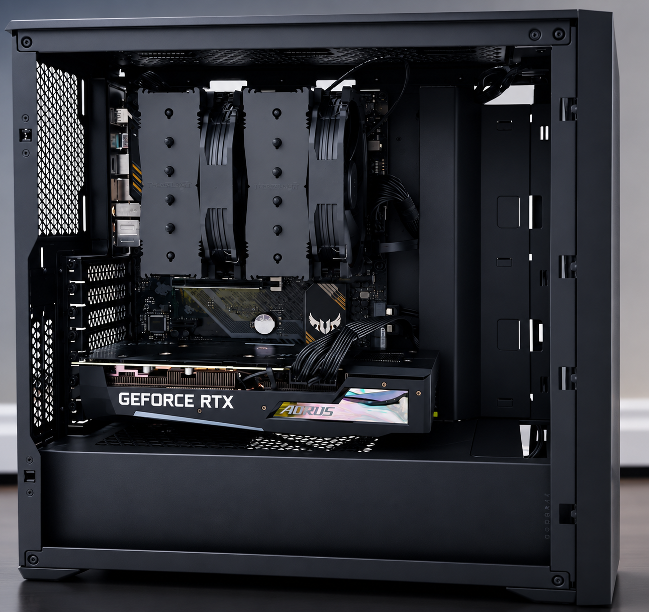 An open mid-tower case showing a dual-tower air cooler, motherboard and graphics card